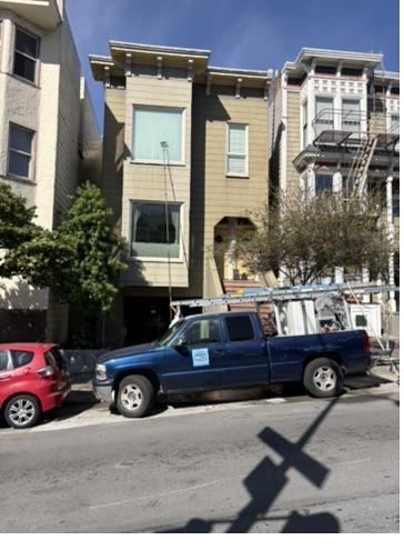 Nick's Pressure Washing service truck on site for an exterior house washing job