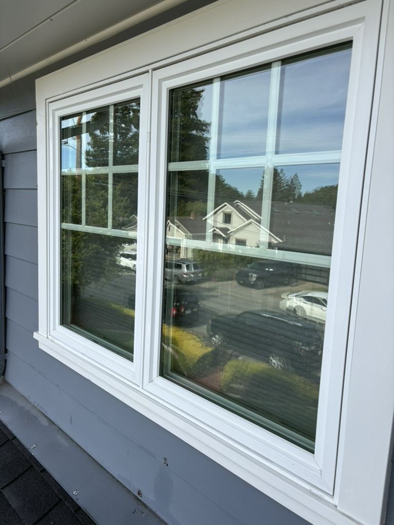 Clean divided-light sash windows with detailed frames and sills on a Peninsula home