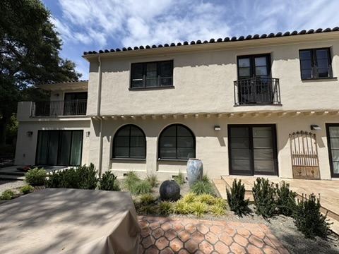 Mediterranean estate exterior with arched windows after professional window cleaning